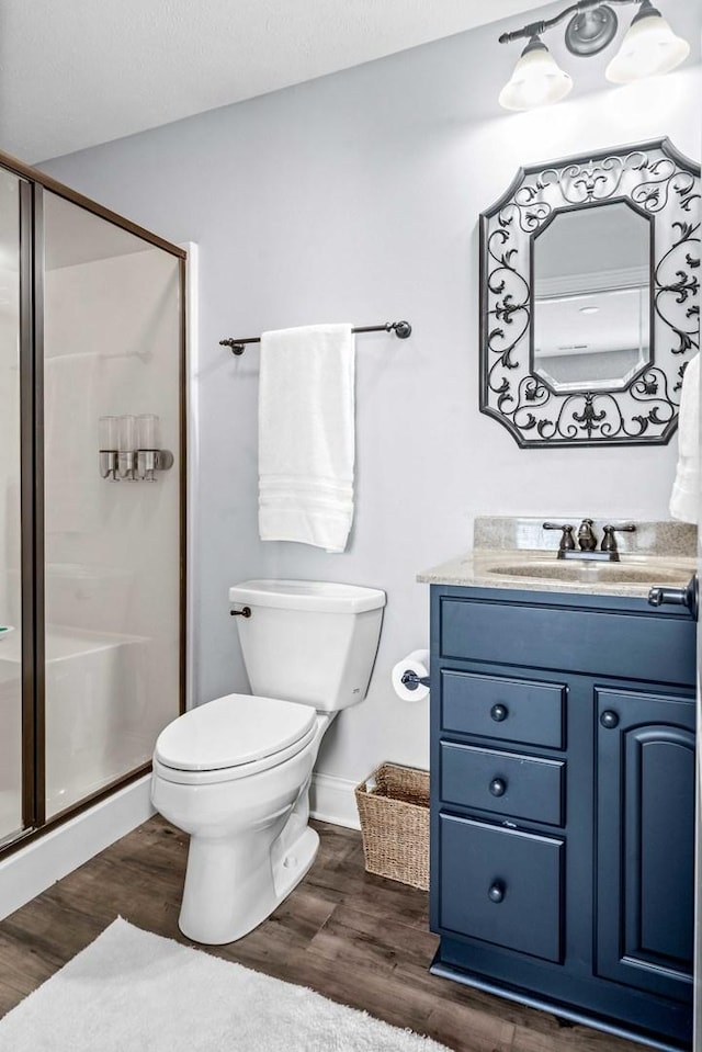 4 Emerald Crest Ct, Bloomington, IL 61705 - bathroom featuring vanity, a shower stall, and wood finished floors