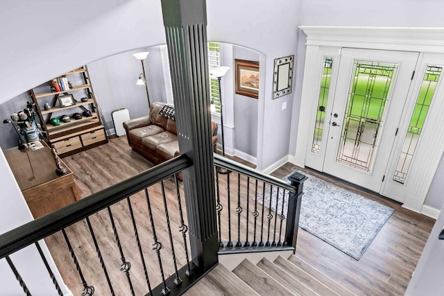 4 Emerald Crest Ct, Bloomington, IL 61705 - foyer with arched walkways, wood finished floors, and stairway