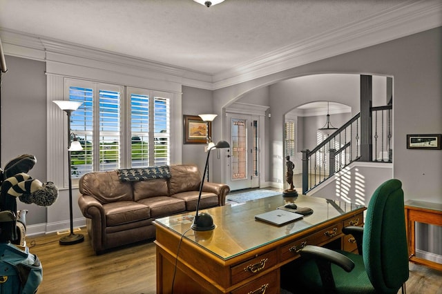 4 Emerald Crest Ct, Bloomington, IL 61705 - office area featuring crown molding, arched walkways, wood finished floors, and a textured ceiling