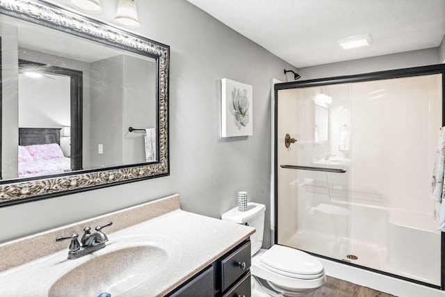 4 Emerald Crest Ct, Bloomington, IL 61705 - bathroom featuring a stall shower, connected bathroom, vanity, and wood finished floors