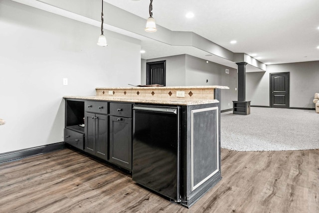 4 Emerald Crest Ct, Bloomington, IL 61705 - kitchen featuring a peninsula, light countertops, decorative light fixtures, recessed lighting, and wood finished floors
