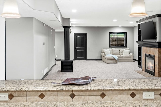 4 Emerald Crest Ct, Bloomington, IL 61705 - living room featuring decorative columns, carpet flooring, a tiled fireplace, and recessed lighting