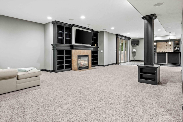 4 Emerald Crest Ct, Bloomington, IL 61705 - carpeted living room featuring ornate columns, a tile fireplace, and recessed lighting