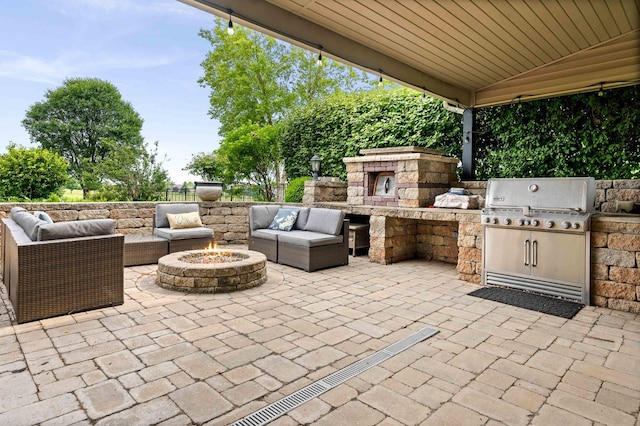 4 Emerald Crest Ct, Bloomington, IL 61705 - view of patio featuring an outdoor living space with a fire pit and an outdoor kitchen
