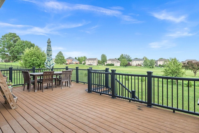 4 Emerald Crest Ct, Bloomington, IL 61705 - deck featuring outdoor dining area, a lawn, and a residential view