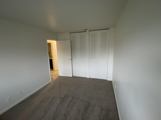 2356 Carnation Dr Unit 0, Crest Hill, IL 60403 - unfurnished bedroom with baseboards, carpet, and multiple closets
