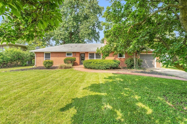 70 Greencroft Dr, Champaign, IL 61821 - ranch-style house with asphalt driveway, brick siding, a front yard, and a garage