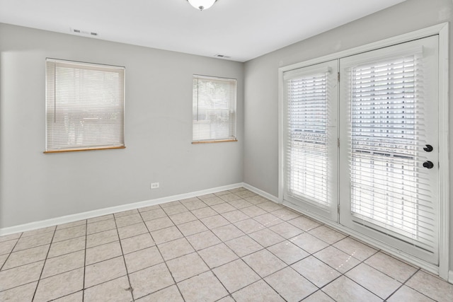 6344 S Rhodes Ave, Chicago, IL 60637 - empty room featuring baseboards and light tile patterned floors