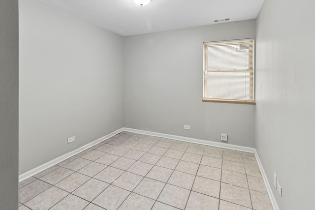 6344 S Rhodes Ave, Chicago, IL 60637 - unfurnished room featuring light tile patterned flooring and baseboards
