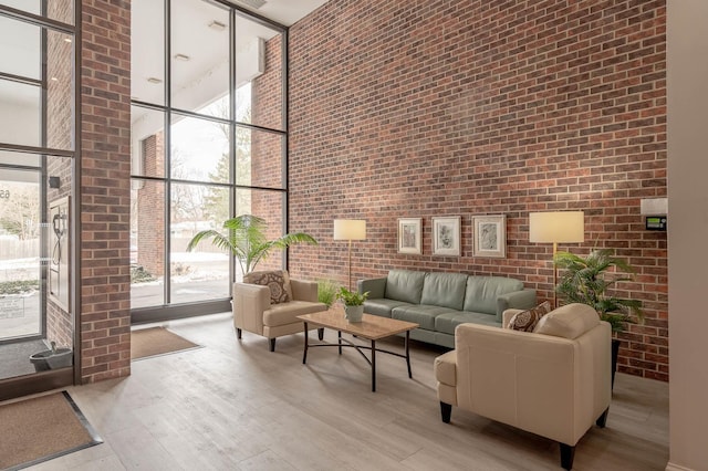 6545 Main St Unit 408, Downers Grove, IL 60516 - community lobby featuring a towering ceiling, floor to ceiling windows, and brick wall