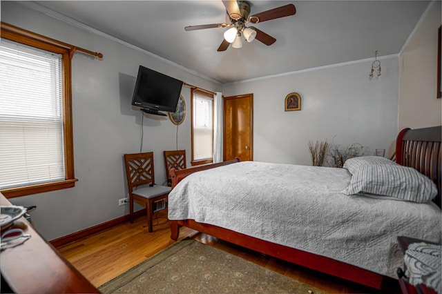 5936 S Keeler Ave, Chicago, IL 60629 - bedroom featuring crown molding, wood finished floors, baseboards, and ceiling fan