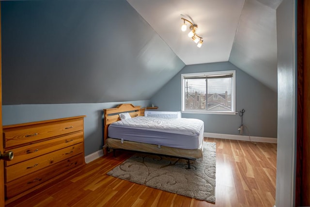 5936 S Keeler Ave, Chicago, IL 60629 - bedroom featuring wood finished floors, lofted ceiling, and baseboards
