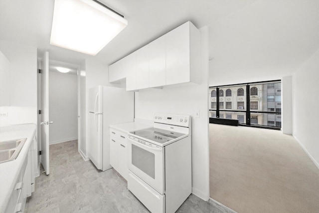 900 N Lake Shore Dr Unit 1104, Chicago, IL 60611 - kitchen with white appliances, white cabinets, baseboards, and light countertops