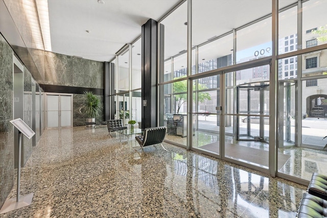 900 N Lake Shore Dr Unit 1104, Chicago, IL 60611 - building lobby with a wall of windows and a high ceiling
