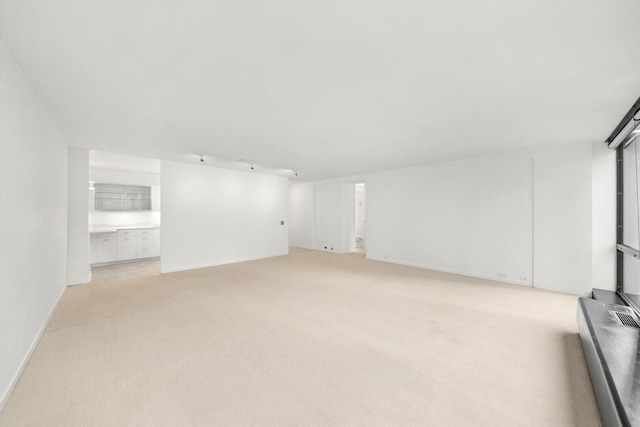 900 N Lake Shore Dr Unit 1104, Chicago, IL 60611 - unfurnished living room featuring light colored carpet and baseboards