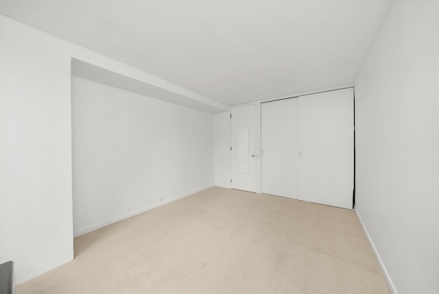 900 N Lake Shore Dr Unit 1104, Chicago, IL 60611 - unfurnished bedroom featuring light colored carpet, a closet, and baseboards