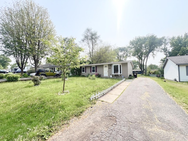 1707 Highview Ave, Mchenry, IL 60050 - ranch-style house featuring driveway and a front yard