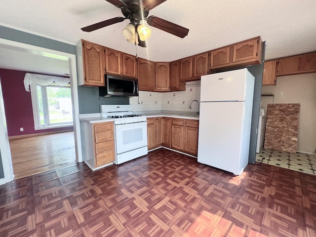 1707 Highview Ave, Mchenry, IL 60050 - kitchen with white appliances, a sink, light countertops, a ceiling fan, and a textured ceiling