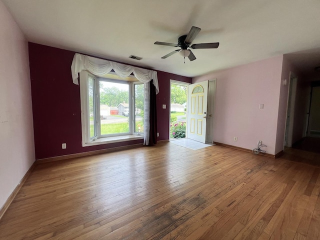 1707 Highview Ave, Mchenry, IL 60050 - empty room with light wood-style flooring, a ceiling fan, and baseboards