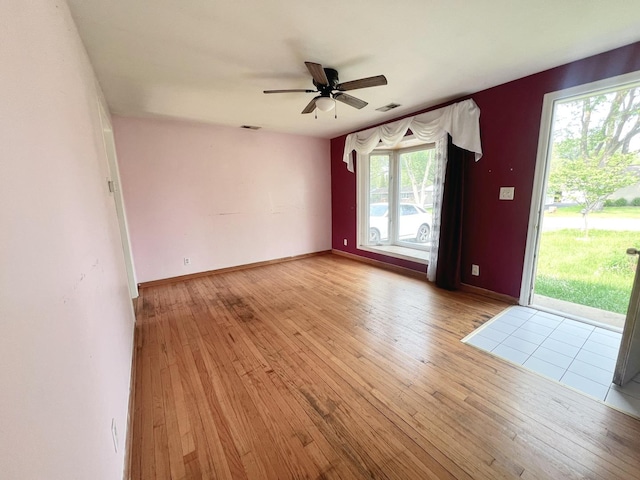 1707 Highview Ave, Mchenry, IL 60050 - spare room featuring wood-type flooring, a ceiling fan, and baseboards