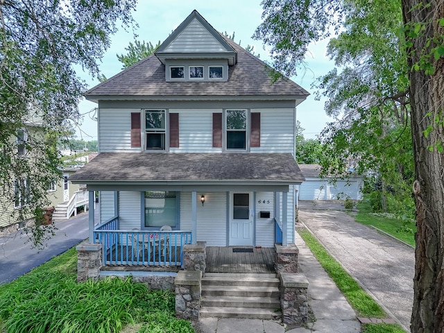 645 E Calhoun St, Woodstock, IL 60098 - view of front of house featuring a porch and a shingled roof