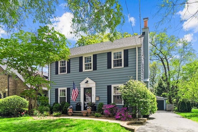 2133 Birchwood Ave, Wilmette, IL 60091 - colonial inspired home with a chimney and a front lawn