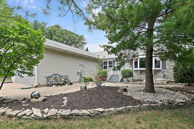 2040 Honey Locust Dr, Algonquin, IL 60102 - rear view of house with an attached garage and driveway