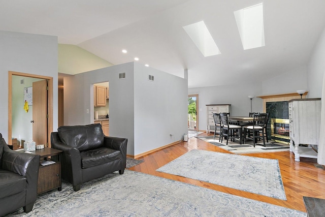 2040 Honey Locust Dr, Algonquin, IL 60102 - living room featuring lofted ceiling, a skylight, light wood-style floors, and recessed lighting