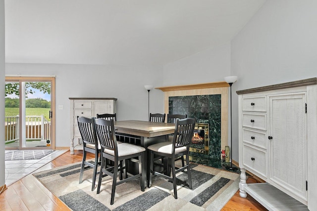 2040 Honey Locust Dr, Algonquin, IL 60102 - dining room with light wood-type flooring, a fireplace, and lofted ceiling