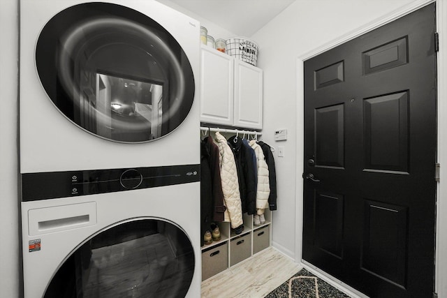 2730 Lorraine Cir, Geneva, IL 60134 - washroom featuring estacked washer and dryer, cabinet space, and baseboards