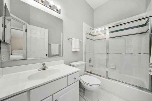 2730 Lorraine Cir, Geneva, IL 60134 - bathroom featuring vanity, combined bath / shower with glass door, and toilet
