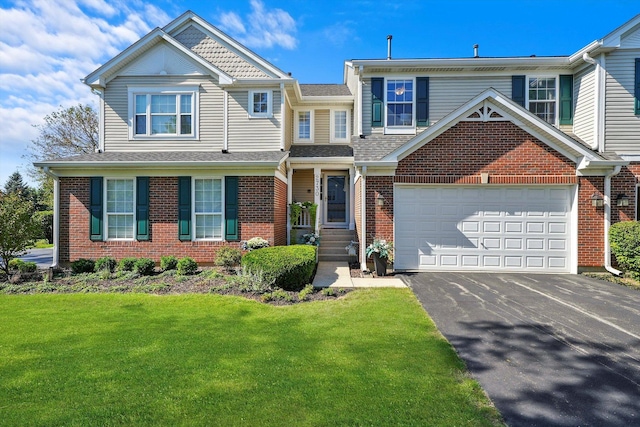 2730 Lorraine Cir, Geneva, IL 60134 - view of front of house featuring asphalt driveway, brick siding, a front lawn, and a garage