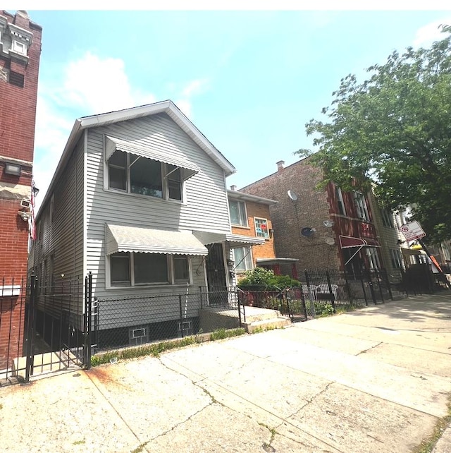 256 W 23rd Pl, Chicago, IL 60616 - view of front facade with a gate