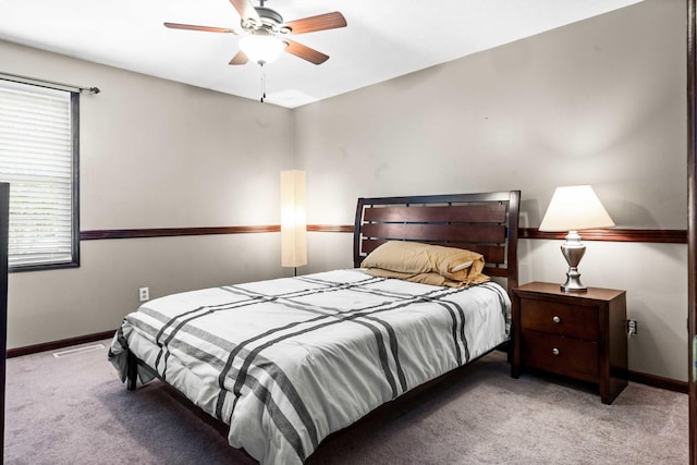606 N Washington St, Hudson, IL 61748 - bedroom with carpet, baseboards, and a ceiling fan