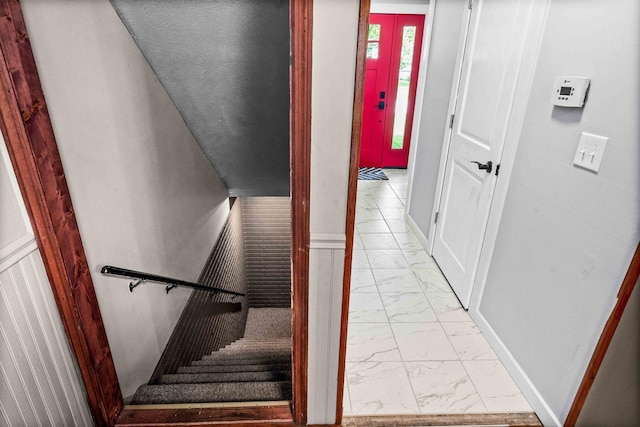 606 N Washington St, Hudson, IL 61748 - staircase featuring marble finish floors and baseboards