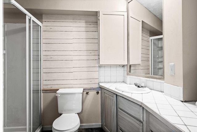 606 N Washington St, Hudson, IL 61748 - bathroom featuring vanity, toilet, and a shower stall