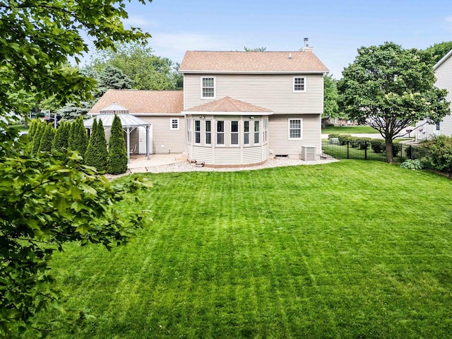 606 N Washington St, Hudson, IL 61748 - back of house with a gazebo, a patio, a chimney, and a shingled roof