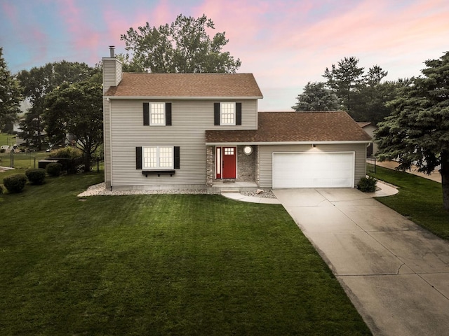 606 N Washington St, Hudson, IL 61748 - traditional-style home featuring an attached garage, a front lawn, and a chimney