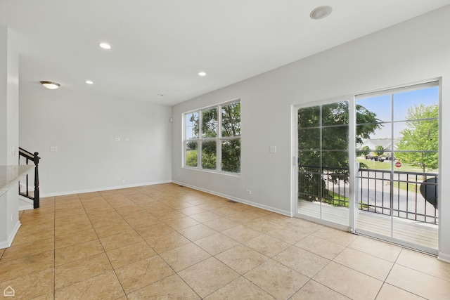 652 Grosvenor Ln, Aurora, IL 60504 - spare room featuring light tile patterned floors, recessed lighting, baseboards, and stairs