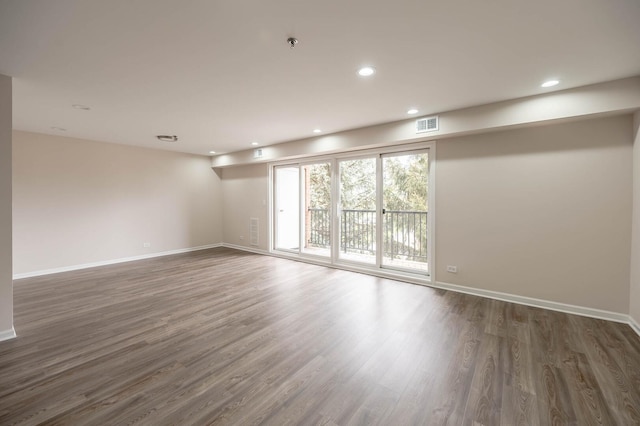 6550 W Gunnison St Unit 303, Harwood Heights, IL 60706 - unfurnished room with wood finished floors, baseboards, a pendent fire sprinkler, and recessed lighting