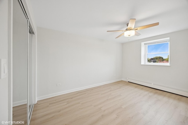 415 Wesley Ave Unit 45, Oak Park, IL 60302 - unfurnished bedroom with light wood-style floors, baseboard heating, baseboards, a closet, and ceiling fan