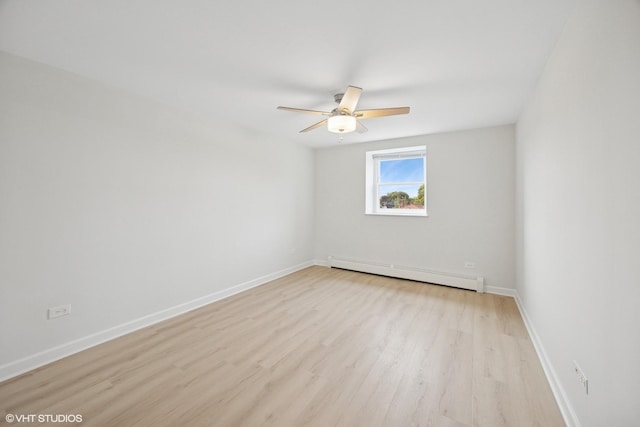 415 Wesley Ave Unit 45, Oak Park, IL 60302 - spare room featuring baseboard heating, light wood finished floors, a ceiling fan, and baseboards