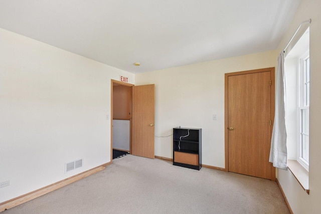1911 Indian Hill Ln, Aurora, IL 60503 - carpeted empty room with baseboards