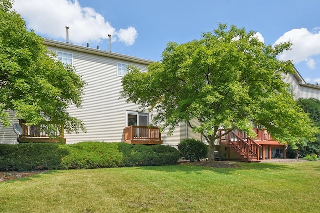 1911 Indian Hill Ln, Aurora, IL 60503 - back of house with a lawn, stairway, and a wooden deck
