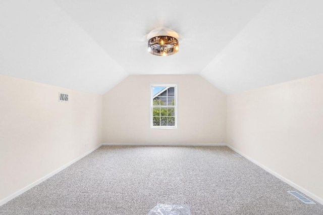 933 Tralee Ct, Gurnee, IL 60031 - additional living space with light carpet, lofted ceiling, and baseboards
