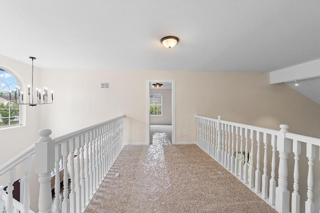 933 Tralee Ct, Gurnee, IL 60031 - hallway with carpet flooring, a chandelier, an upstairs landing, and baseboards