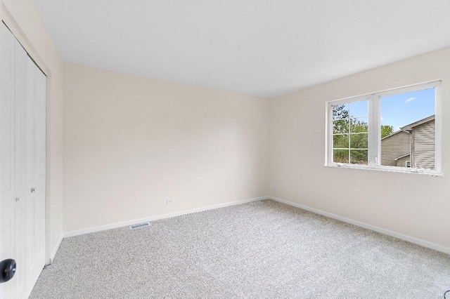 933 Tralee Ct, Gurnee, IL 60031 - unfurnished bedroom with carpet, a closet, and baseboards