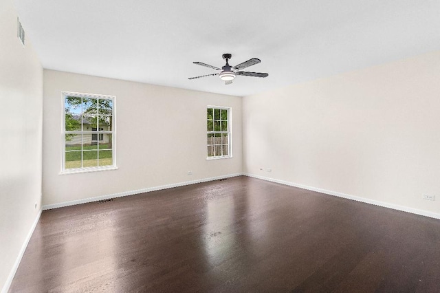 933 Tralee Ct, Gurnee, IL 60031 - unfurnished room with plenty of natural light, ceiling fan, baseboards, and dark wood-style floors