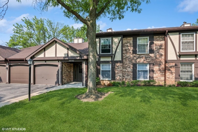 2980 Northampton Dr Unit A2, Rolling Meadows, IL 60008 - tudor house with a chimney, brick siding, and a front yard