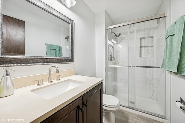 2980 Northampton Dr Unit A2, Rolling Meadows, IL 60008 - full bath with toilet, vanity, a shower stall, and wood finished floors